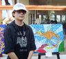Artista de 17 años con su obra en oleo sobre tela de estilo propio en la exposicion Los Colores del Mar en el Hotel Mocambo Veracruz